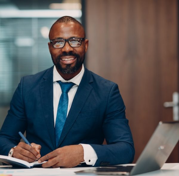 boss-smiling-african-american-businessman-sitting-2024-12-01-15-18-18-utc