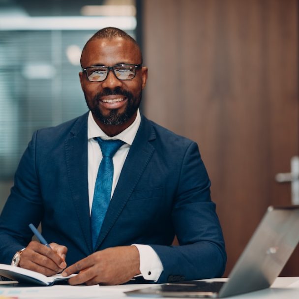 boss-smiling-african-american-businessman-sitting-2024-12-01-15-18-18-utc