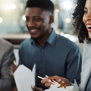 Chinese food, collaboration and a business woman with her team in the office for a meeting while ea.